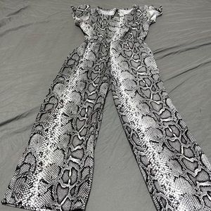A black and gray snake print romper
